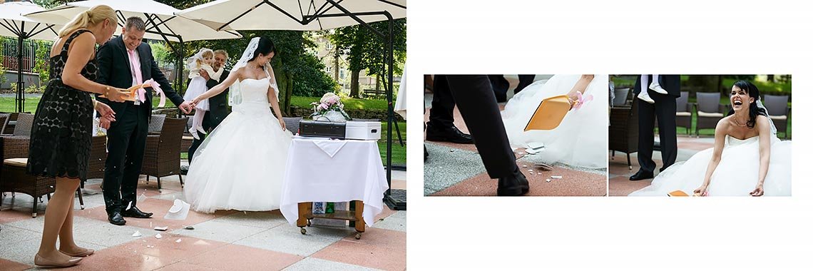 nevěsta s ženichem zametají střepy z rozbitého talíře nevěsta s ženichem zametají střepy z rozbitého talíře